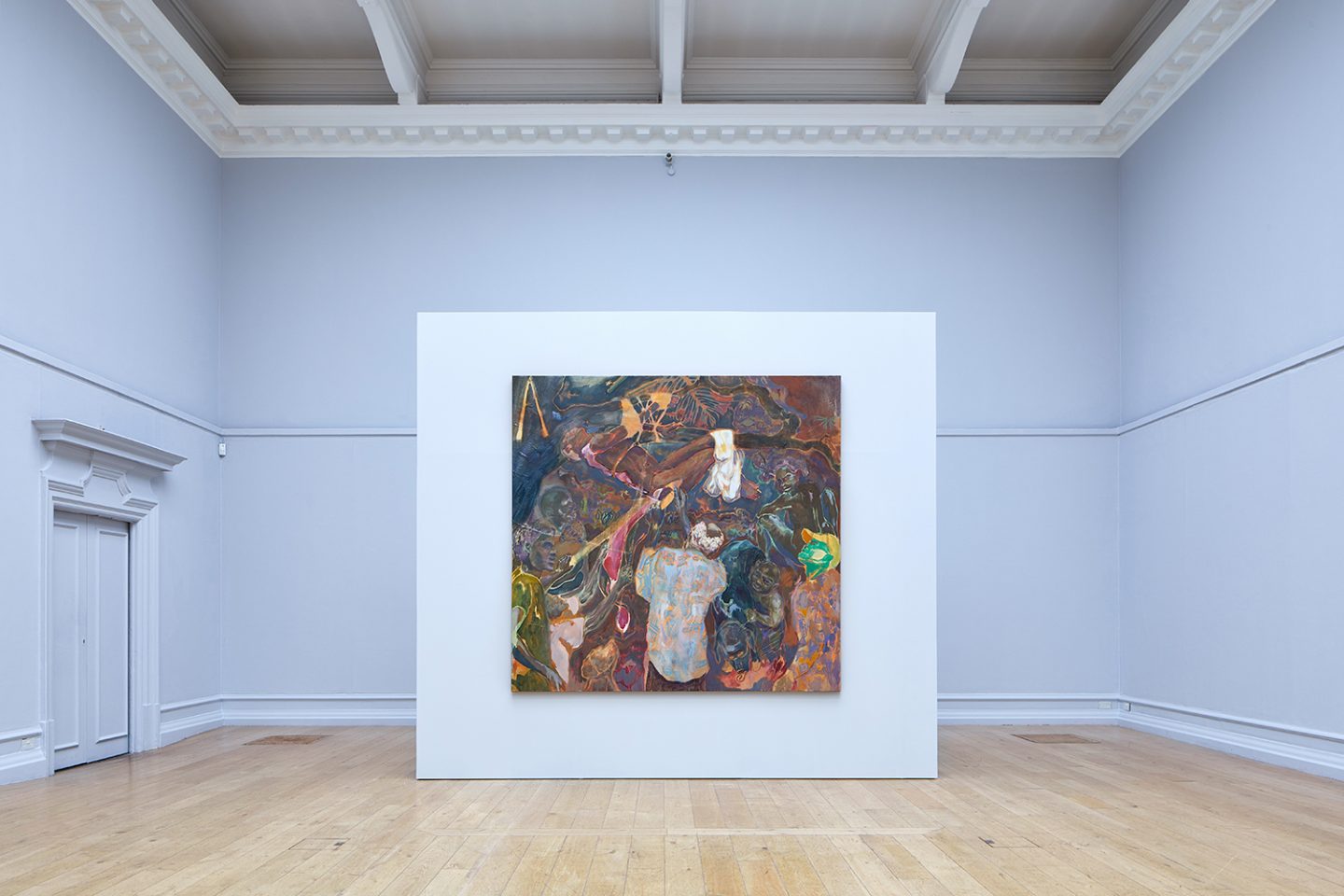 A painting from The Chapel mounted on a partition wall at the end of the main galleries.