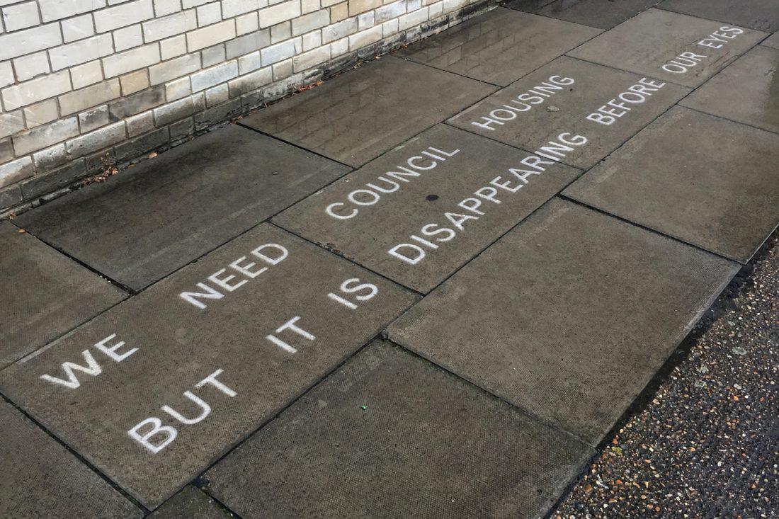 <p>Jessie Brennan, <em>We need council housing but it is disappearing before our eyes</em>, 2017, text in water-repellent spray, (words by Susan), temporarily sited on Pelican Estate. Photo: Jessie Brennan</p>
