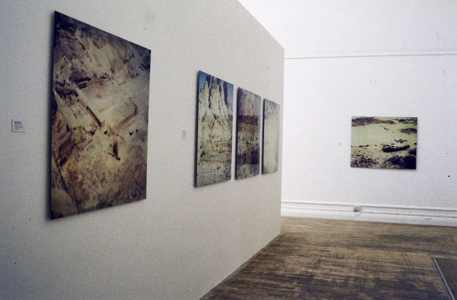 Installation view from 1997 exhibition Desert, featuring works by Hannah Collins, Knut Maron, Sophie Ristelhueber, Michael Rovner, Thomas Ruff, Frederick Sommer, Bill Viola, Verdi Yahooda. Curated by Jim Harold.
