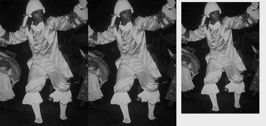 Black and white photo of Curtly Thomas in white shiny frilly clothes and white wig