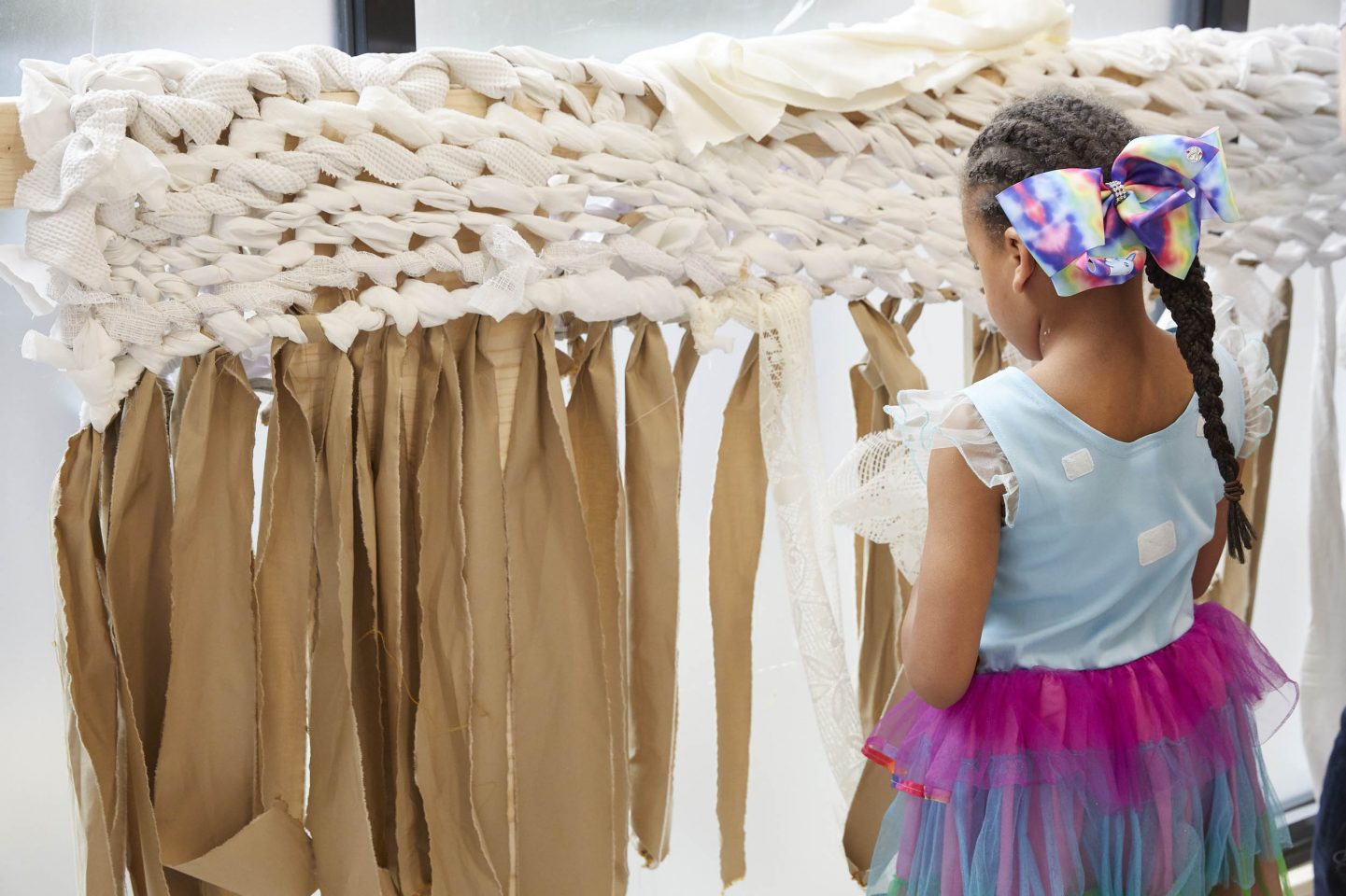 Child weaving as part of Victoria-Idongesit Udondian's Art Block commission Àdápé,