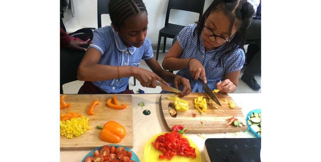 <p>Chopping vegetables at Art Block, 2019</p>