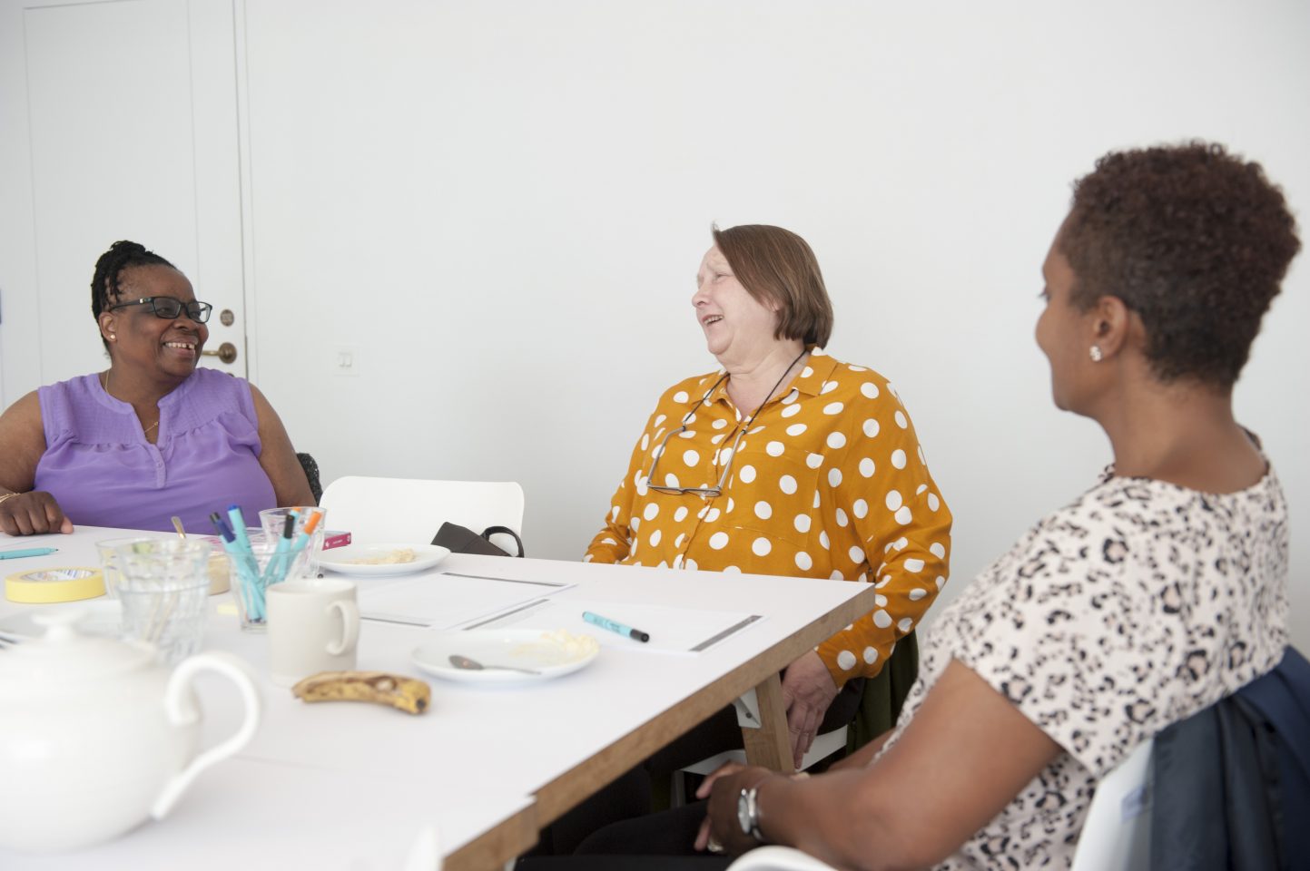 Carers in discussion in the SLG Fire Station Kitchen