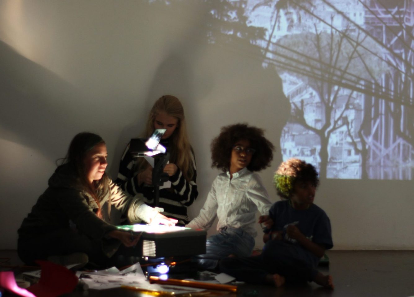 Children in the Clore Studio with a projection behind them