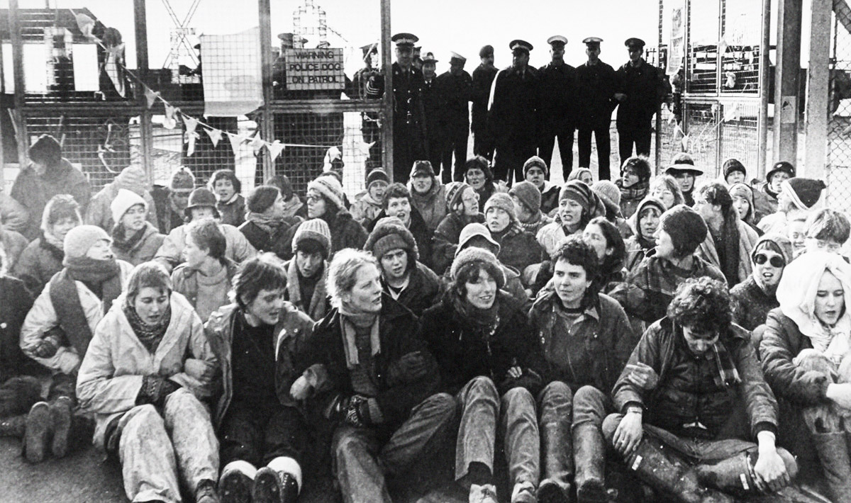 Greenham group sitting infront of police. Photo: Lesley McIntyre