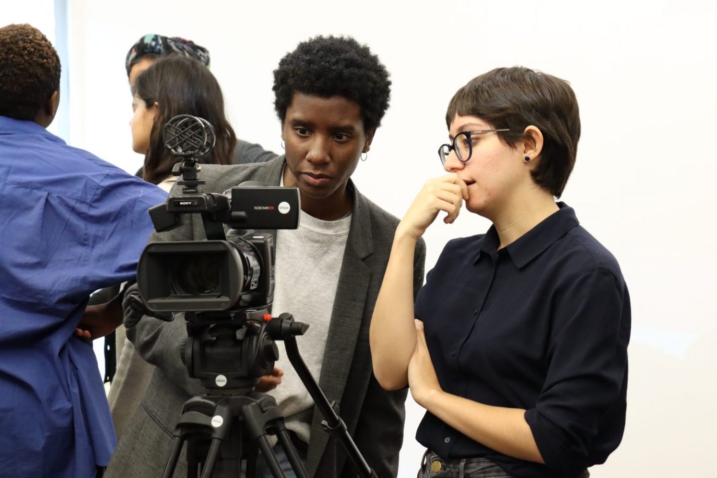 Two REcreative film school students working with a professional camera