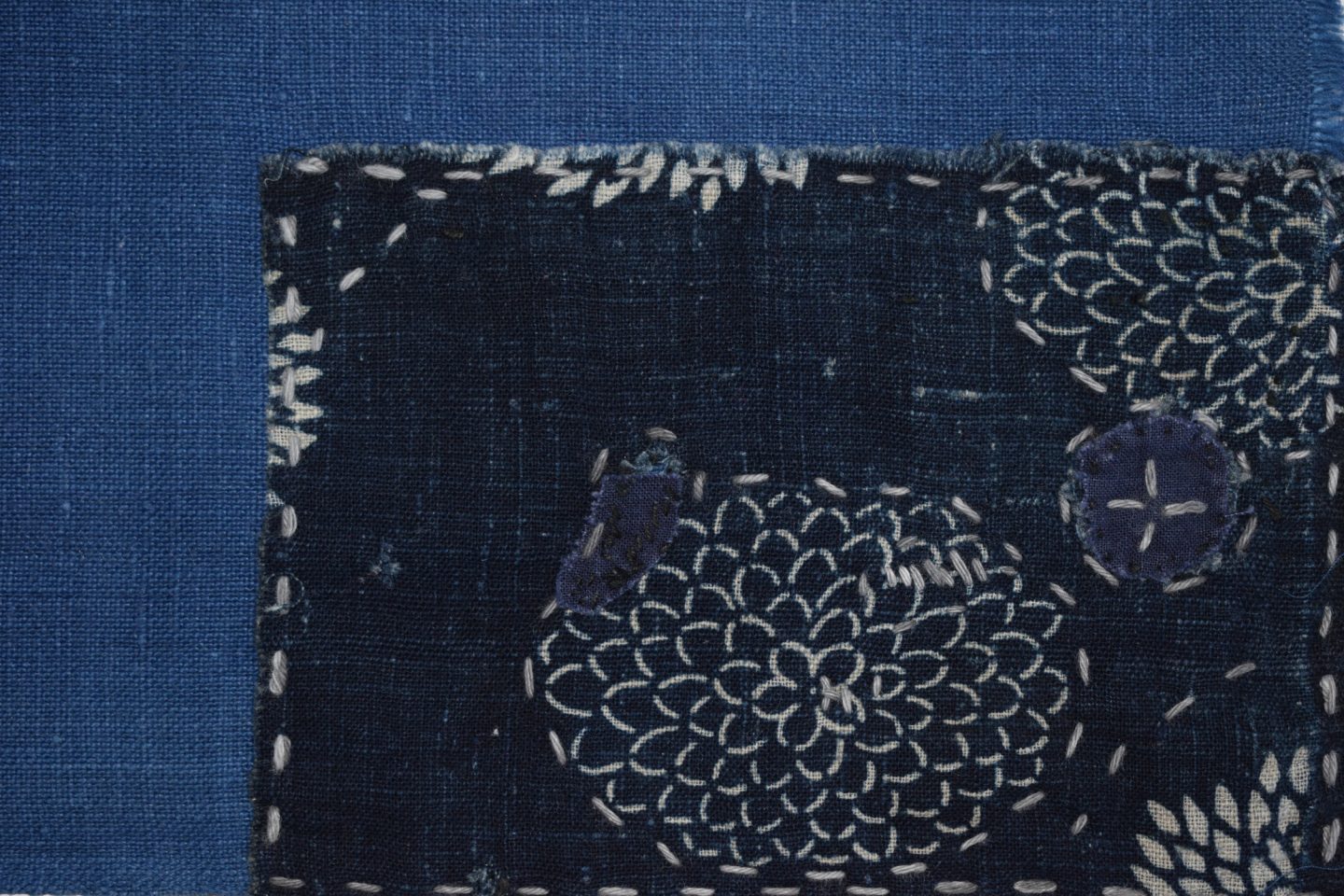A stitched and patterned piece of fabric