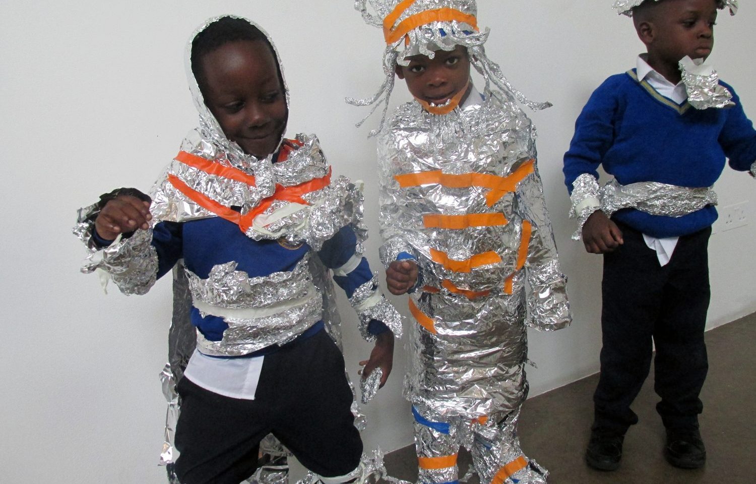 Children with foil costumes