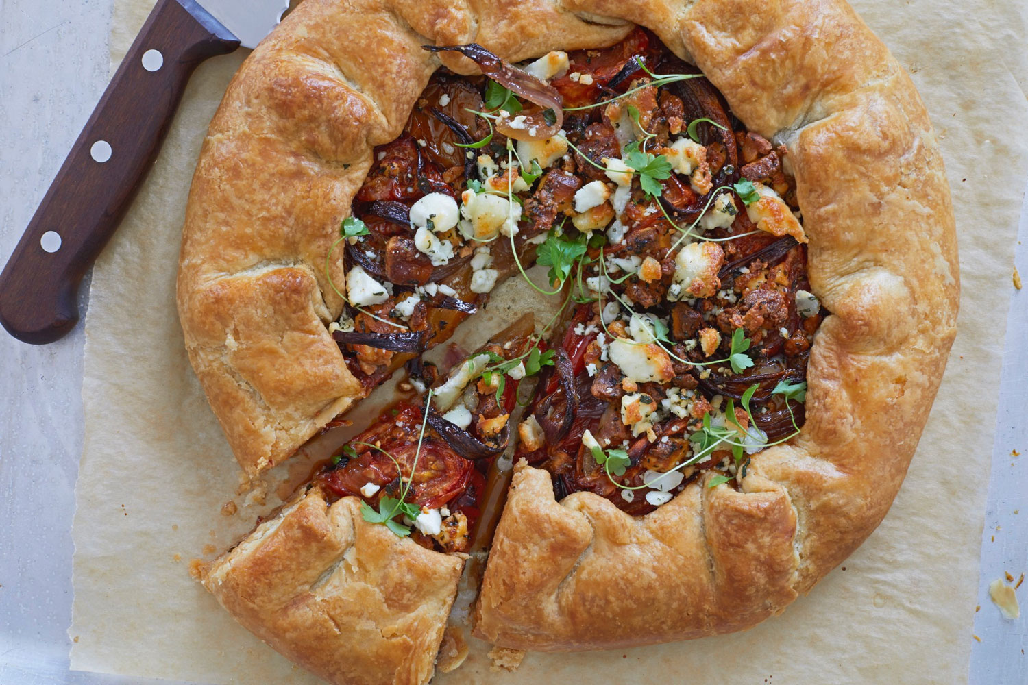 A pastry galette, filled with vegetables and cheese