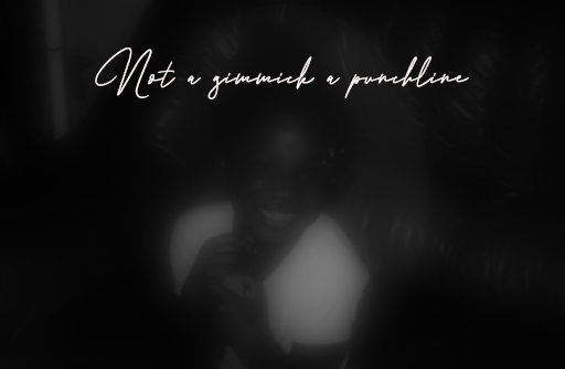 Blurred black and white photo of someone smiling, with 'not a gimmick, a punchline' written at the top