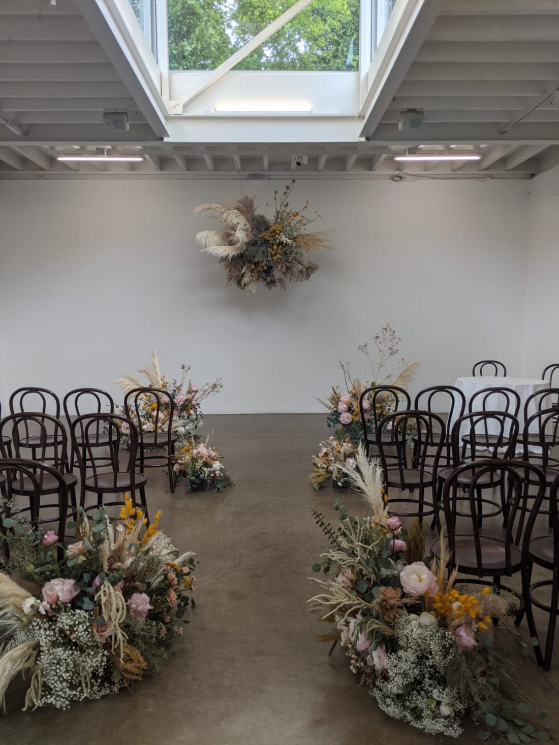 <p>A wedding ceremony in the Clore Studio. Flowers by Worm.</p>
