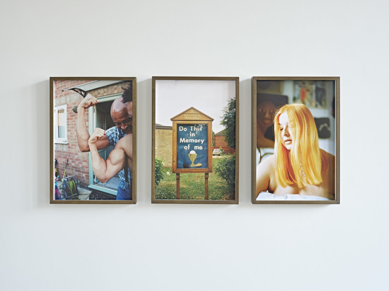 Three framed photographs hanging on a white wall