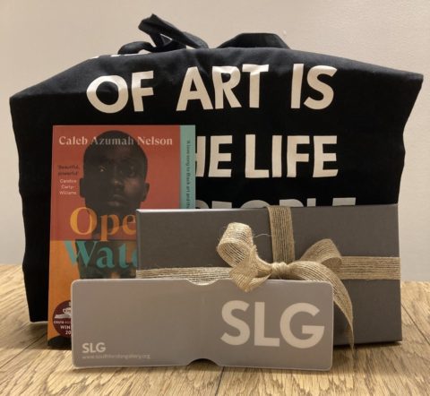 A book, tote bag and membership card