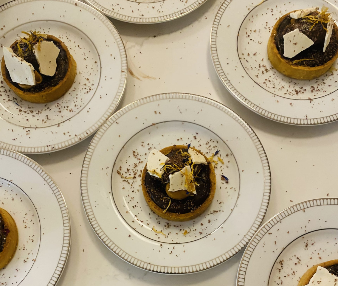 A flat lay photo of plates on a table with food on them.