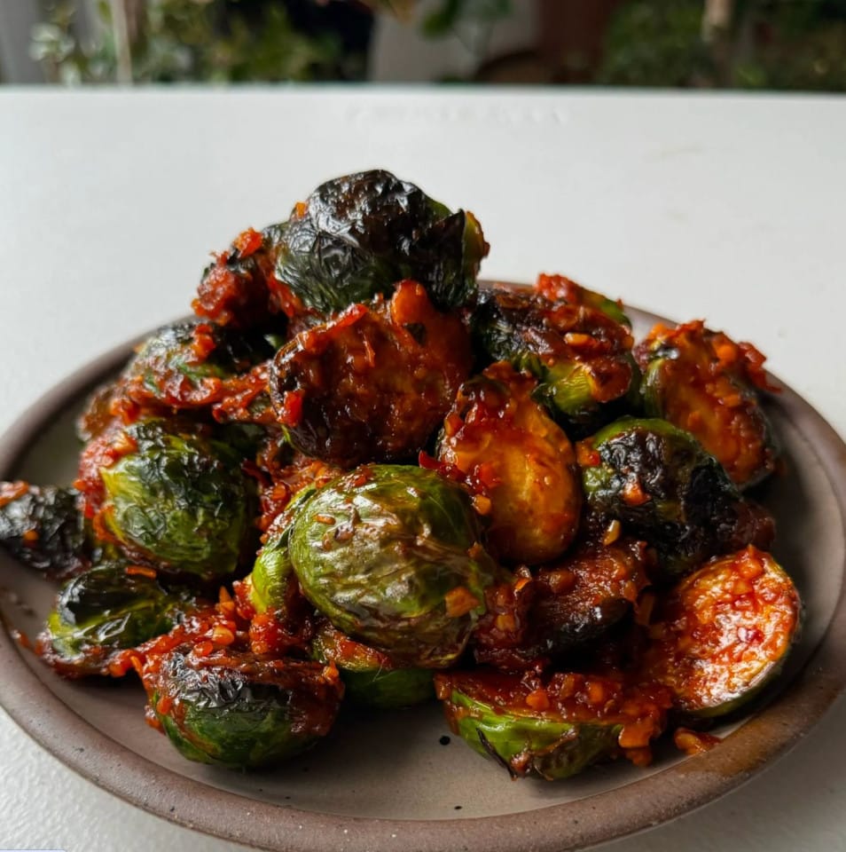 Brussel sprouts with a red, chilli sauce