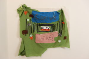 A collaged hand-made poster with the words Can We Play Here?