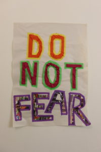 A collaged hand-made poster with the words Do Not Fear