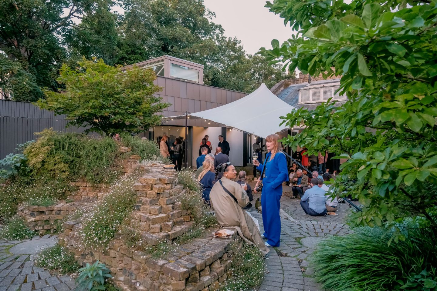 People standing in the South London Gallery's Orozco Garden
