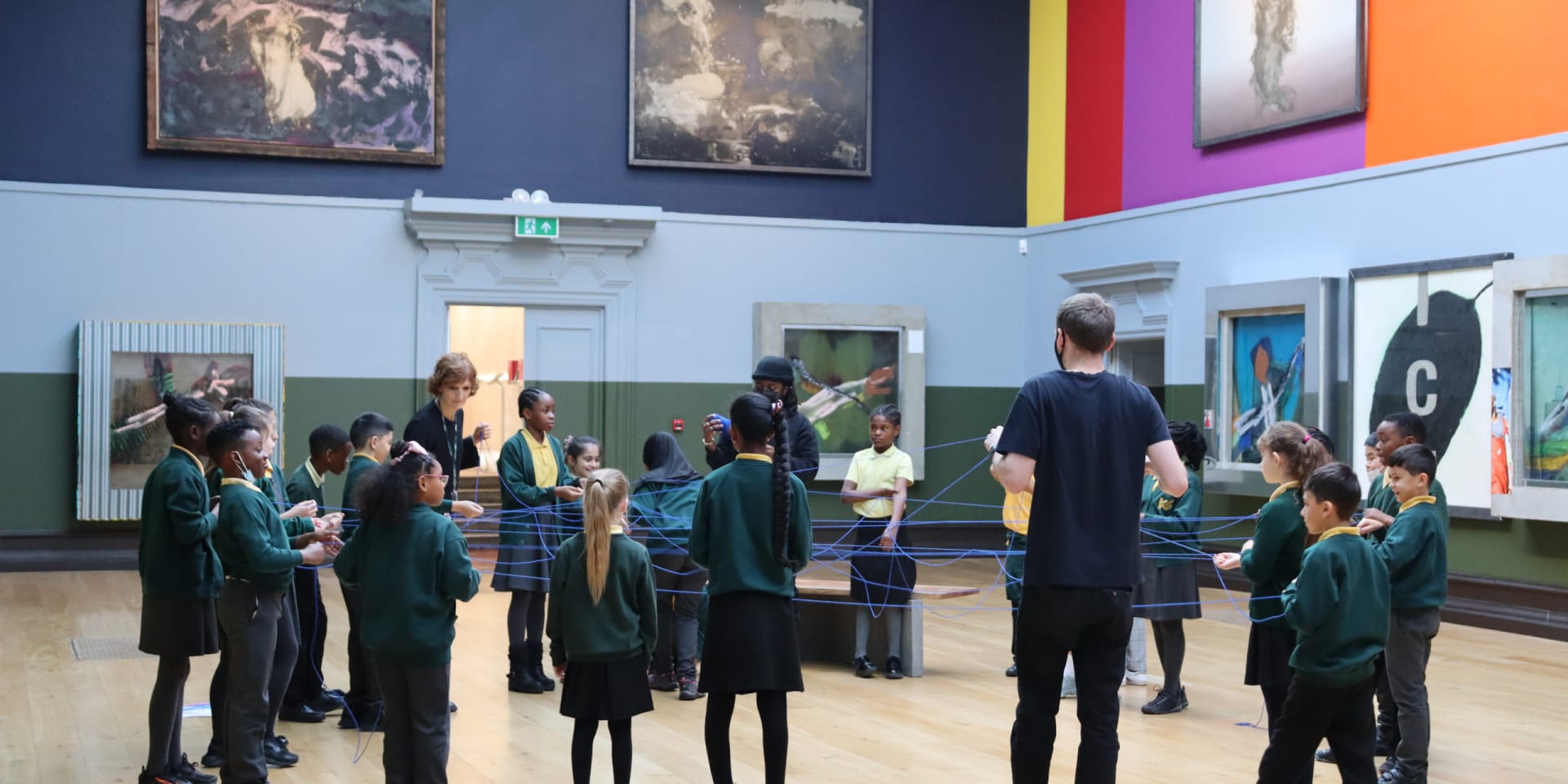 A school group in a bright colourful art gallery in south London.