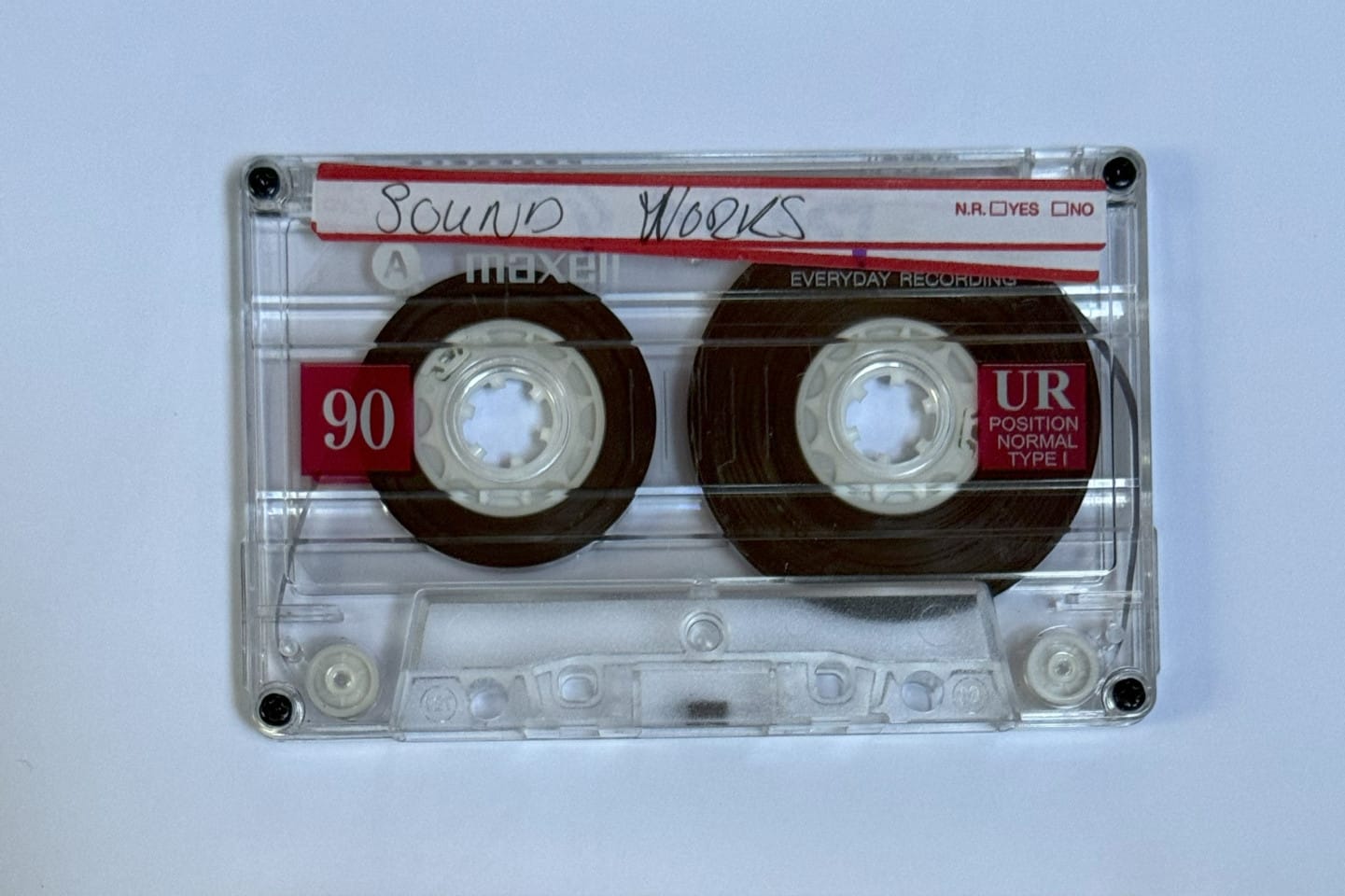 A ohoto of a tape on a white table. A handwritten label on the tape reads: Sound Works