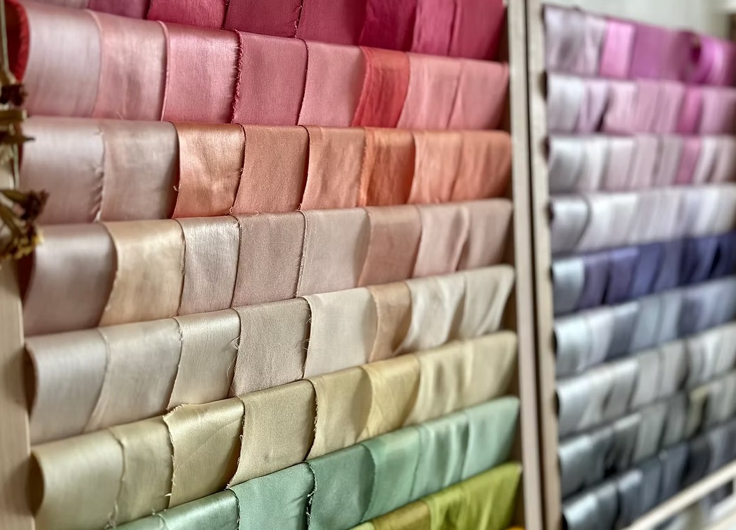 A wall of colourful naturally dyed fabrics.