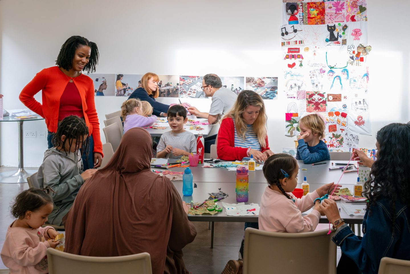 A group of families take part in a fun creative workshop at the SLG.