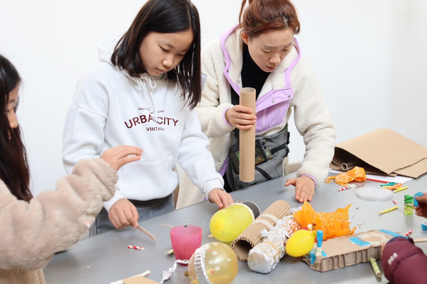 Adult and child take part in a creative family workshop